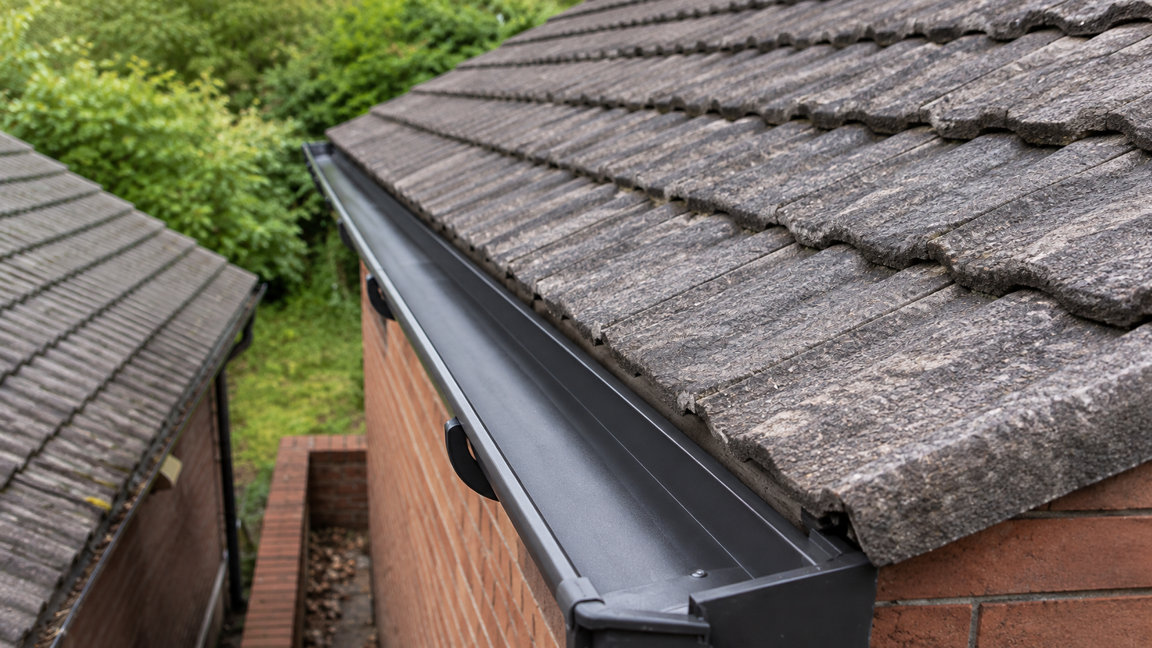 Post-clean gutter verification showing completely cleared channel